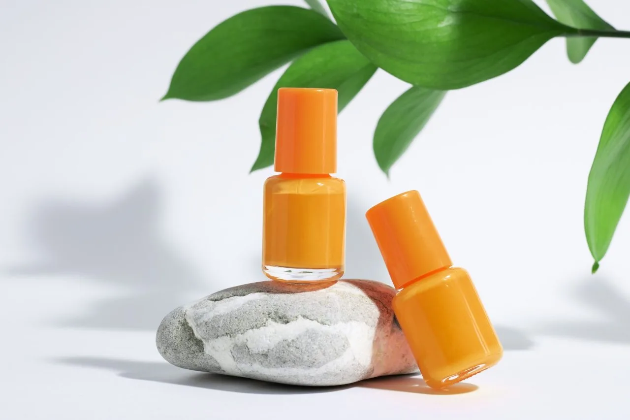 Manicure Or Pedicure Background Creative Mockup Of Isolated Cosmetics Bottles With Orange | AR Webcrafts
